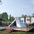 White Outdoor Camping Tent On Wooden Platform With Grill Decorative Screens And Lush Grass