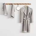 Wooden Ladder Style Bathroom Shelf with Folded Towels and Hanging Bathrobe