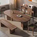 Walnut Oval Dining Table Set With Bench Chairs Potted Plant Lamp And Wall Artwork