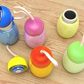 Colorful Stainless Steel Cups With Lanyards On Wooden Table