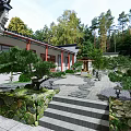 Traditional Chinese Ancient Architecture Courtyard With Stone Pathway Pine Trees And Lanterns