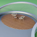 Outdoor Relaxation Space With Circular Wooden Deck Curved Mesh Railing Two Chairs And Small Table
