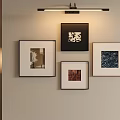 Elegant Interior Wall With Four Framed Artworks And Modern Floor Lamp Decor