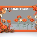 Floral Display with Orange Frame Welcome Home Sign and Orange White Roses Decorative Setup