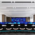 Modern Control Room Interior Featuring Multiple Monitoring Screens Console And Black Chairs