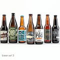 Assorted Craft Beer Bottles With Different Brand Labels On White Background