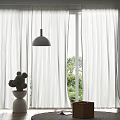 White Sheer Curtains With Modern Pendant Light And Cactus Plant In Sunlit Room