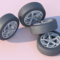 Four Modern Car Tires With Stylish Alloy Wheels And Silver Rims