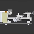 Industrial Lathe Machine With Yellow Control Panel And Rotating Metal Components