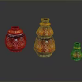 Carved Glass Vases in Red and Orange Patterns with Various Sizes on Black Background
