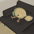 Cartoon Fruit Shaped Pillows With Smiling Faces Green Leaves Large And Small On Brown Sofa