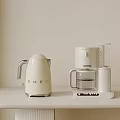 White Electric Kettle And Coffee Maker As Modern Household Electrical Appliances On Countertop