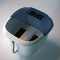 White Household Appliance With Blue Transparent Lid Wheels And Flexible Hose
