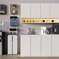 Modern Kitchen With White Cabinets And Daily Electrical Appliances Like Coffee Maker And Water Dispenser