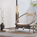 Modern Woven Round Leisure Chair With White Cushion Side Table Floor Lamp And Green Plants