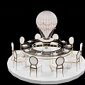 Elegant Round Dining Table Setup with White Chairs Gold Accents and Hot Air Balloon Model