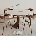 Round Wooden Dining Table With Four Chairs Featuring Light Colored Seats And Small Plant on Top