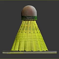 Yellow Badminton Shuttlecock Equipment With White Green Cork Top On Gray Base