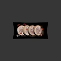 Panda Shaped Roll Cakes on Black Plate with Red Goji Berries