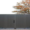 Dark Gray Metal Gate With Vertical Slats And Autumn Tree In Yard