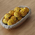 Golden Sesame Seed Bread Rolls in Wicker Basket on Wooden Table
