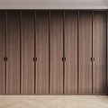 Modern Wooden Wardrobe with Sleek Panel Design and Minimalist Door Handles in Bright Interior Space