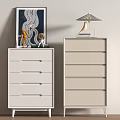 Modern White and Beige Chest of Drawers with Framed Artwork Table Lamp and Figurines