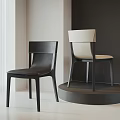 Modern Single Chair With White Backrest And Black Seat On Circular Display Stand