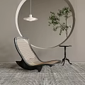 Modern Lounge Chair With Circular Wall Decoration Pendant Light Green Plant And Textured Rug