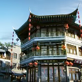 Traditional Chinese Commercial Street With Overhanging Eaves Red Lanterns And Multi Story Shops