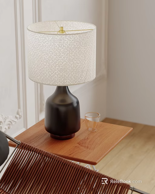 Black Base Table Lamp With White Textured Shade On Wooden Table And Small Glass Cup 3d model 