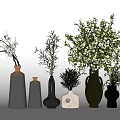 Various Shapes Black White Ceramic Vases With White Flowers Green Foliage And Dried Plants