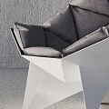 Modern Geometric Leisure Chair With White Frame And Gray Padded Cushions