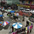 Bustling Wet Market Scene With Colorful Umbrellas Stalls And Crowded People