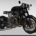 Vintage Black Motorcycle With Copper Accents Spoked Wheels And Single Seat Design