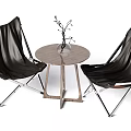 Modern Black Leather Chairs and Round Wooden Table Set with Metal Frame and Decorative Plant
