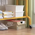 Gold Rolling Clothing Rack With Hanging Folded Clothes And Shoes