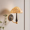 Beige Patterned Shade Wall Lamp With Black Gold Body On Light Wall And Green Plant