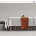 Spa Massage Bed With White Sheet Brown Towel Stool And Essential Oil Bottles