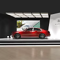 Exhibition Booth Displaying Red Mercedes Car With Large Screen Background And Decorative Tree Lighting