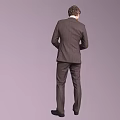 Man In Brown Suit With Tie Holding Papers Full Length