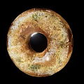 Appetizing Golden Brown Freshly Baked Bagel With Hole And Crusty Surface On Black Background