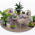 Outdoor Rattan Table And Chair Set With Green Plants On Wooden Deck