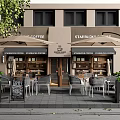 Starbucks Coffee Storefront With Outdoor Seating Area Umbrellas Green Plants And Menu Board