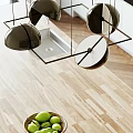 Modern Chandelier with Black and White Circular Pendants Hanging Above Wooden Kitchen Counter