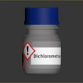 Transparent Glass Bottle With Blue Cap And Warning Hazard Symbols For Household Use
