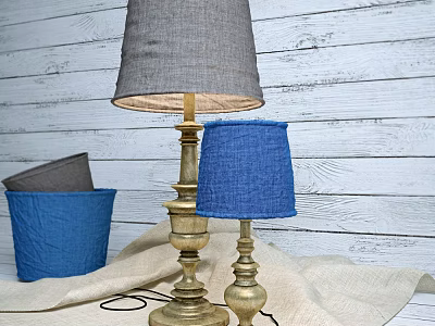 Vintage Table Lamps With Golden Bases Gray And Blue Fabric Shades On Wooden Wall Background 3d model