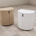 Two Wooden And White Curved Decorative Cabinets With Vertical Striped Surface On Light Wood Floor