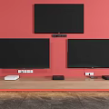 Three TVs Mounted on Red Wall With Wooden TV Stand And Media Devices