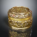 Elegant Gold Fashion Accessory Box With Intricate Patterns And Colorful Gemstones